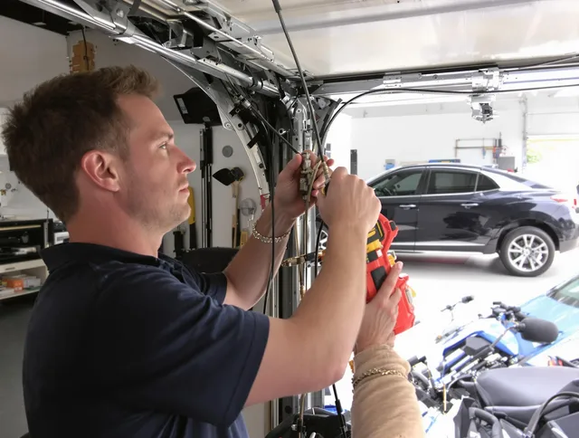 Bennett Garage Door Repair safety certified technician performing cable replacement in Bennett