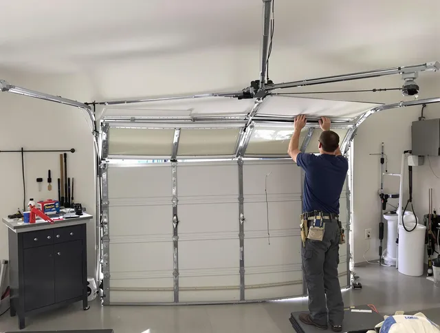 Bennett Garage Door Repair specialist performing precise section replacement on Bennett garage door